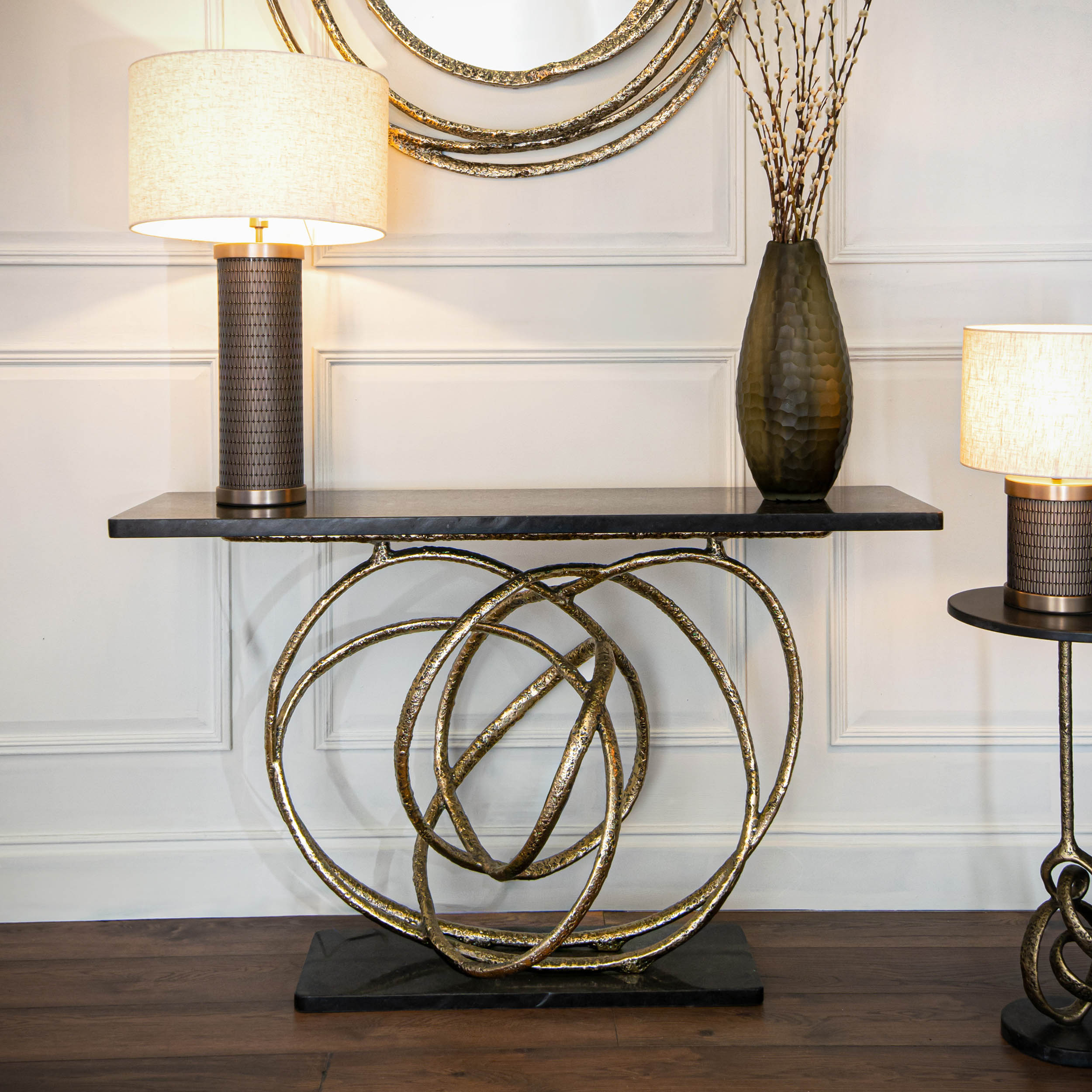 Orla brass and black granite console